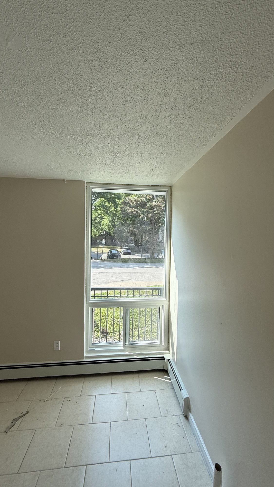 New white high-rise window with fixed glass and a lower sliding section