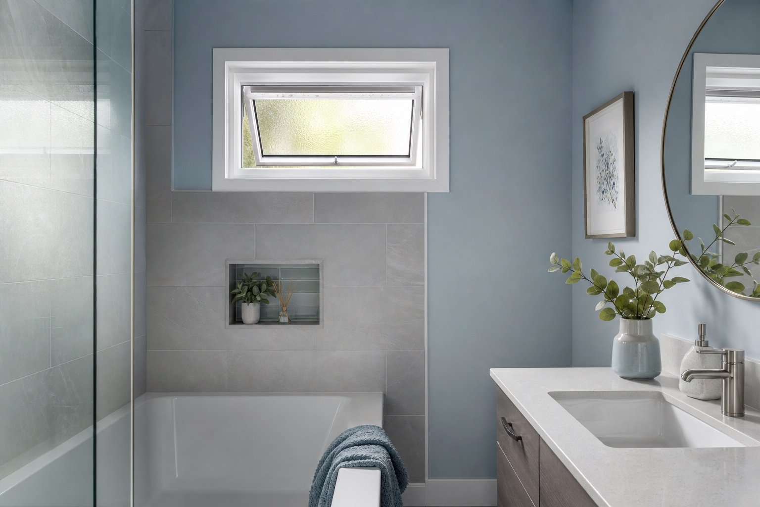 Operable awning window with privacy glass in a bathroom